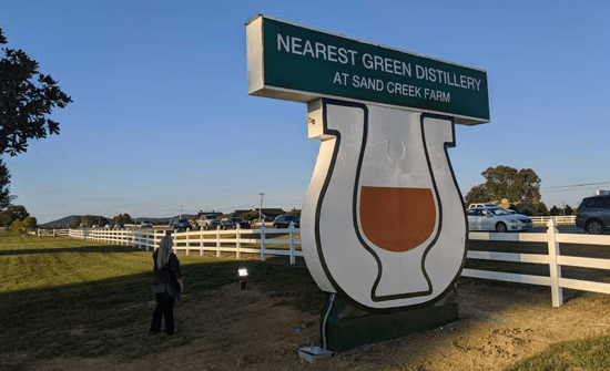 A sign that says nearest green winery.