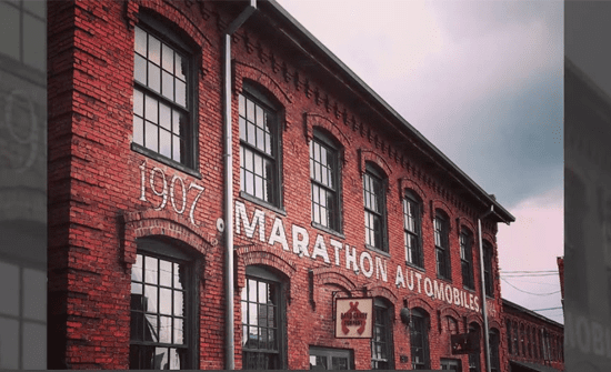 A photo of a brick building with the word marathon on it.