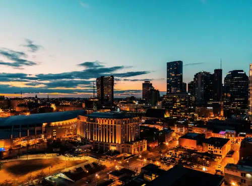 An aerial view of a transportation service in a city at dusk.