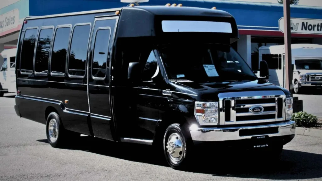 Black 20 passenger bus costing $270 per hour for rental