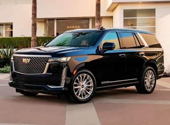 A black Cadillac SUV parked in a parking lot