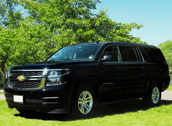 Jet Black Suburban SUV parked in a parking lot