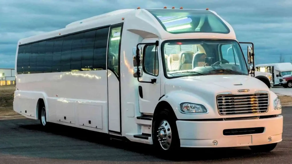 A white party bus roaming on the streets of USA