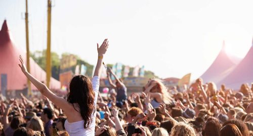 A crowd of people at a music festival.